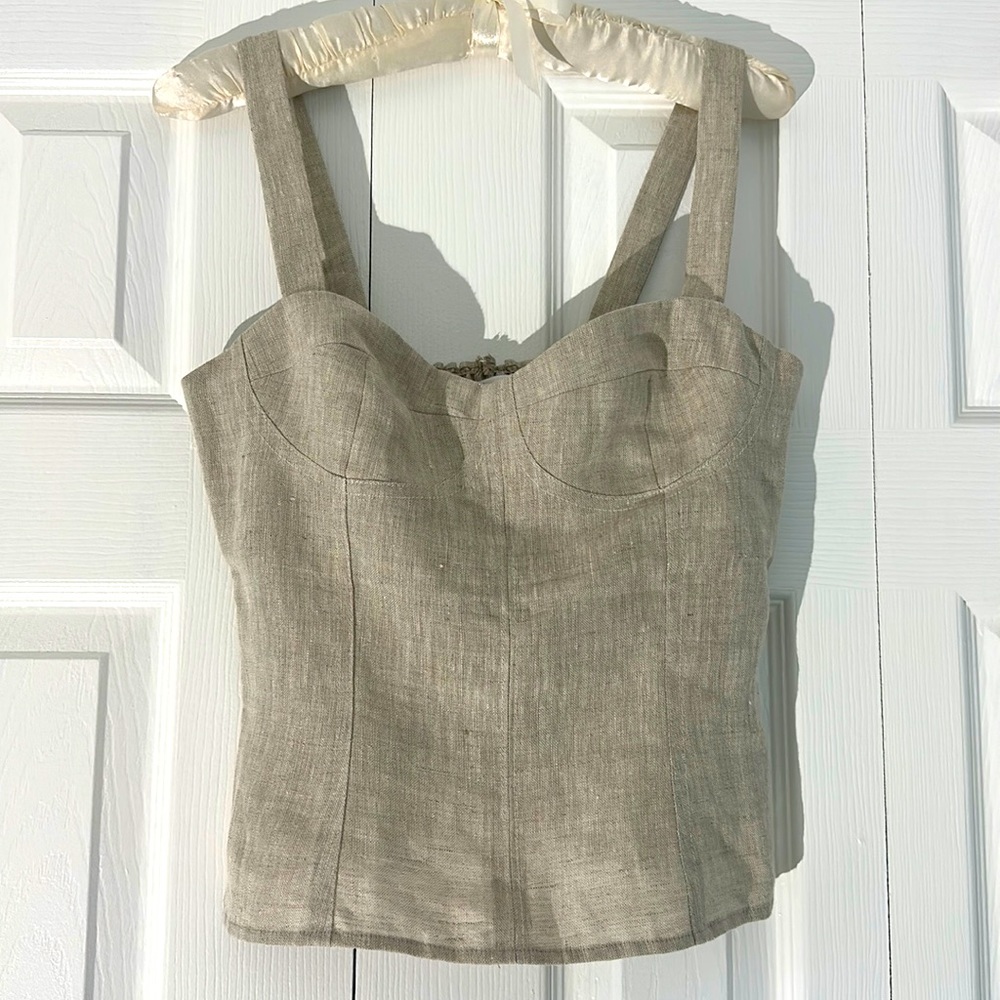 Reformation linen top in tan with elastic panel and zipper in back.